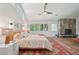 Spacious main bedroom with vaulted ceilings, stone fireplace, wood floors, and expansive windows at 1255 Cold Harbor Dr, Roswell, GA 30075
