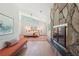 Spacious main bedroom with stone fireplace, hardwood floors and natural light at 1255 Cold Harbor Dr, Roswell, GA 30075