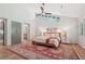 Bright main bedroom featuring vaulted ceilings, wooden floors, and a large decorative rug at 1255 Cold Harbor Dr, Roswell, GA 30075