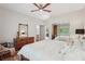 Well-lit main bedroom featuring a mirrorred closet and hardwood flooring at 1255 Cold Harbor Dr, Roswell, GA 30075