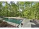 Beautiful in-ground pool with a spacious patio and comfortable seating for relaxation and entertainment at 1255 Cold Harbor Dr, Roswell, GA 30075