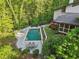 A backyard with a private pool, lounge chairs, and outdoor dining area at 1255 Cold Harbor Dr, Roswell, GA 30075