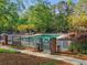 Community pool offers a refreshing escape, with a fenced-in area for safety and beautiful landscaping at 1255 Cold Harbor Dr, Roswell, GA 30075