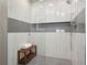Modern glass shower with built-in bench, white tile walls, and sleek fixtures for a luxurious bathing experience at 1255 Cold Harbor Dr, Roswell, GA 30075