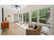 Sitting area with large sliding doors, hardwood floors, and light neutral interior at 1255 Cold Harbor Dr, Roswell, GA 30075