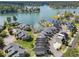 Beautiful aerial shot of lakeside townhomes with private boat slips and community amenities at 14020 Tributary Ln, Villa Rica, GA 30180