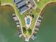 Stunning aerial view of the community featuring a pool, docks, and boat slips on the serene lake at 14020 Tributary Ln, Villa Rica, GA 30180