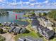Stunning aerial view of lakefront townhomes, showcasing the community's scenic waterfront location and community boat dock at 14020 Tributary Ln, Villa Rica, GA 30180