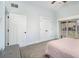 Bedroom featuring neutral decor, vaulted ceiling, large closet and access to outdoor balcony at 14020 Tributary Ln, Villa Rica, GA 30180