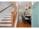 Inviting entryway with hardwood floors, staircase, and an open view into the kitchen and living spaces at 14020 Tributary Ln, Villa Rica, GA 30180