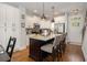 Modern kitchen features granite countertops, stainless steel appliances and beautiful hardwood floors at 14020 Tributary Ln, Villa Rica, GA 30180