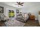 Cozy bedroom with a sliding glass door that provides a view of the outdoors and access to natural light at 14020 Tributary Ln, Villa Rica, GA 30180