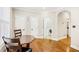 Bright breakfast nook features an octagonal table, hardwood floors, and convenient access to the laundry room and pantry at 1429 Ferocity Ridge Nw Way # 12, Kennesaw, GA 30152