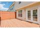 Spacious wooden deck with an outdoor entertainment space and clear sliding-glass doors at 1429 Ferocity Ridge Nw Way # 12, Kennesaw, GA 30152