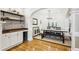 Spacious dining room features wood floors, an elegant chandelier, and bar area with wine cooler at 1429 Ferocity Ridge Nw Way # 12, Kennesaw, GA 30152