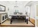 The dining room features a modern chandelier, beautiful sideboard, and an open floorplan at 1429 Ferocity Ridge Nw Way # 12, Kennesaw, GA 30152