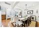 Formal dining room with natural light, hardwood floors, decorative columns, and an open floor plan at 1429 Ferocity Ridge Nw Way # 12, Kennesaw, GA 30152