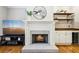 Elegant fireplace with decorative mantel and built-in bar area at 1429 Ferocity Ridge Nw Way # 12, Kennesaw, GA 30152