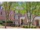 Brick townhome featuring a charming front entrance and well-maintained landscaping at 1429 Ferocity Ridge Nw Way # 12, Kennesaw, GA 30152