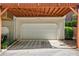 Attached garage with wooden awning creates covered parking for residents at 1429 Ferocity Ridge Nw Way # 12, Kennesaw, GA 30152