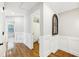 Hallway featuring hardwood floors and wainscotting provides access to rooms at 1429 Ferocity Ridge Nw Way # 12, Kennesaw, GA 30152