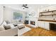 Cozy living room with fireplace, built-in bar, and comfortable seating at 1429 Ferocity Ridge Nw Way # 12, Kennesaw, GA 30152