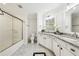 Bright bathroom boasts double sinks, granite countertops, updated mirrors, and a glass enclosed shower at 1429 Ferocity Ridge Nw Way # 12, Kennesaw, GA 30152