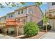Rear exterior featuring multi-level deck and patio of two-story home with garage at 1429 Ferocity Ridge Nw Way # 12, Kennesaw, GA 30152