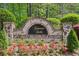 Stone and brick monument sign for Kennesaw Battle community with colorful landscaping at 1429 Ferocity Ridge Nw Way # 12, Kennesaw, GA 30152
