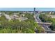 Expansive aerial view showcasing the property's proximity to highway and surrounding shopping and wooded area at 3155 Boldmere Se Trl # 3, Smyrna, GA 30080