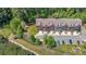 Aerial view showcasing the neighborhood of townhomes, surrounded by lush trees at 3155 Boldmere Se Trl # 3, Smyrna, GA 30080