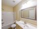 Bathroom featuring a shower-tub combo, sink, and a large framed mirror at 3155 Boldmere Se Trl # 3, Smyrna, GA 30080