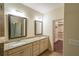 Bathroom featuring double sinks, granite countertops, and a walk-in closet at 3155 Boldmere Se Trl # 3, Smyrna, GA 30080