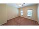 Bedroom with neutral walls, carpet flooring, a ceiling fan and two windows with blinds at 3155 Boldmere Se Trl # 3, Smyrna, GA 30080