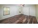 Spacious bedroom featuring wood floors, a ceiling fan, and a Murphy bed at 3155 Boldmere Se Trl # 3, Smyrna, GA 30080
