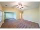 Spacious bedroom with neutral carpet, a ceiling fan, and a vaulted ceiling at 3155 Boldmere Se Trl # 3, Smyrna, GA 30080