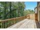 Wooden deck overlooking a lush green yard with mature trees at 3155 Boldmere Se Trl # 3, Smyrna, GA 30080
