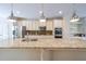 Spacious kitchen with granite countertops, stainless steel appliances, and decorative lighting at 3155 Boldmere Se Trl # 3, Smyrna, GA 30080