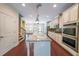 Spacious island kitchen with hardwood floors and stainless appliances at 3155 Boldmere Se Trl # 3, Smyrna, GA 30080