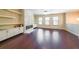 Bright living room boasts a marble fireplace, built-in shelving, and hardwood floors at 3155 Boldmere Se Trl # 3, Smyrna, GA 30080