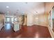 Open floorplan featuring hardwood floors, an island kitchen, and adjacent living room at 3155 Boldmere Se Trl # 3, Smyrna, GA 30080