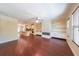 Spacious open floorplan with hardwood floors, an island kitchen, and a fireplace at 3155 Boldmere Se Trl # 3, Smyrna, GA 30080