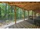 Covered outdoor patio offering ample space for entertaining with wooded view at 3155 Boldmere Se Trl # 3, Smyrna, GA 30080