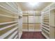 Well-organized walk-in closet with built-in shelving and hanging racks for ample storage at 3155 Boldmere Se Trl # 3, Smyrna, GA 30080