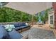 Backyard featuring a raised deck, outdoor furniture, with a cover shade at 100 Coldwater Creek Dr, Mcdonough, GA 30252