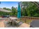 Backyard featuring a raised deck, outdoor furniture, and a large seating area at 100 Coldwater Creek Dr, Mcdonough, GA 30252