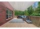 Backyard featuring a raised deck, outdoor furniture, with a cover shade at 100 Coldwater Creek Dr, Mcdonough, GA 30252