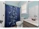 Full bathroom with a blue color scheme, sink, toilet, and walk-in shower at 100 Coldwater Creek Dr, Mcdonough, GA 30252