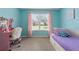 Light-filled bedroom with pastel walls, a plush chair, and a cozy single bed at 100 Coldwater Creek Dr, Mcdonough, GA 30252