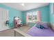 Bright bedroom with pastel walls, plush chair at vanity, and a cozy single bed at 100 Coldwater Creek Dr, Mcdonough, GA 30252